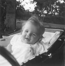 Smiling Louise sitting in the carriage pram where Jean found her having the first seizure