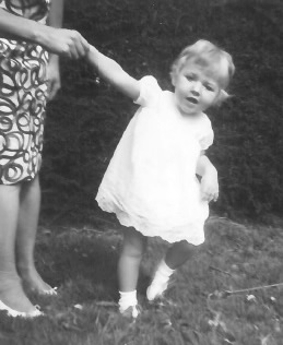 Louise learning to walk with the ever present hand of her mother Jean